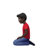 kniender Mann: dunkle Hautfarbe